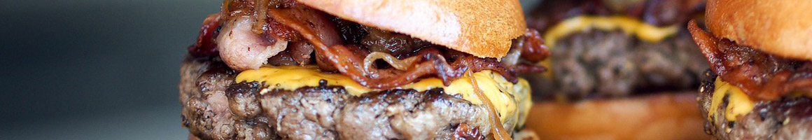 Eating American (Traditional) Burger at Perry's Vashon Burgers restaurant in Vashon, WA.